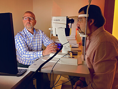 Dr. Sullivan Performing an Eye Exam on a Patient