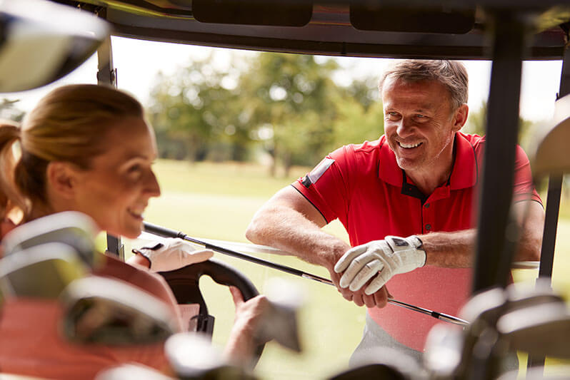 Couple Talking on the Golf Course